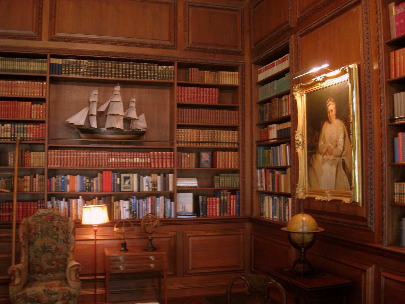 A wood-paneled private library in a wealthy estate, lined floor to ceiling with old books, a model ship and a gilded portrait